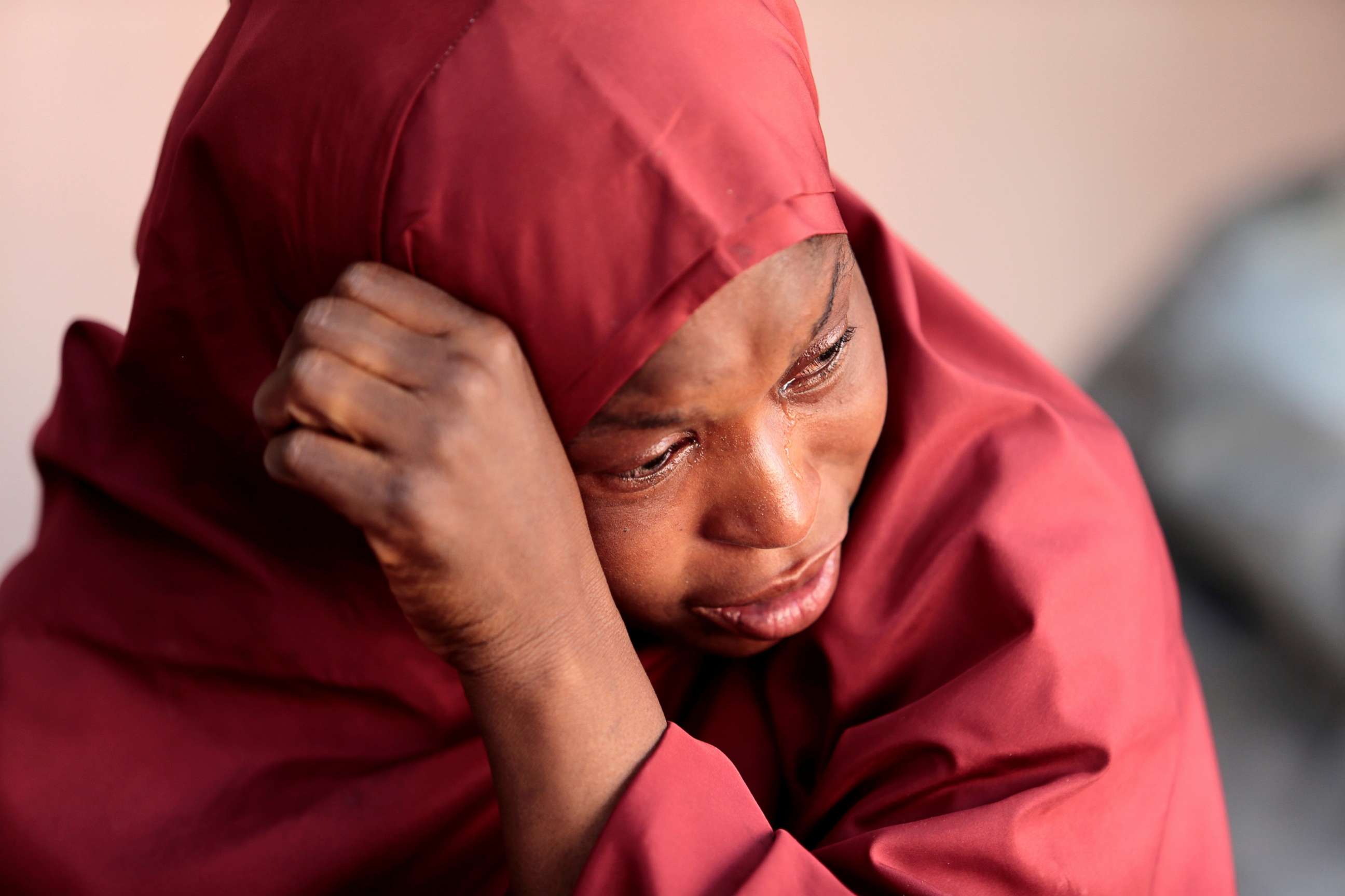 PHOTO: The mother of Muhammad Bello, one the students who was abducted by gunmen, cries in Kankara, in northwestern Katsina state, Nigeria on Dec. 14, 2020.