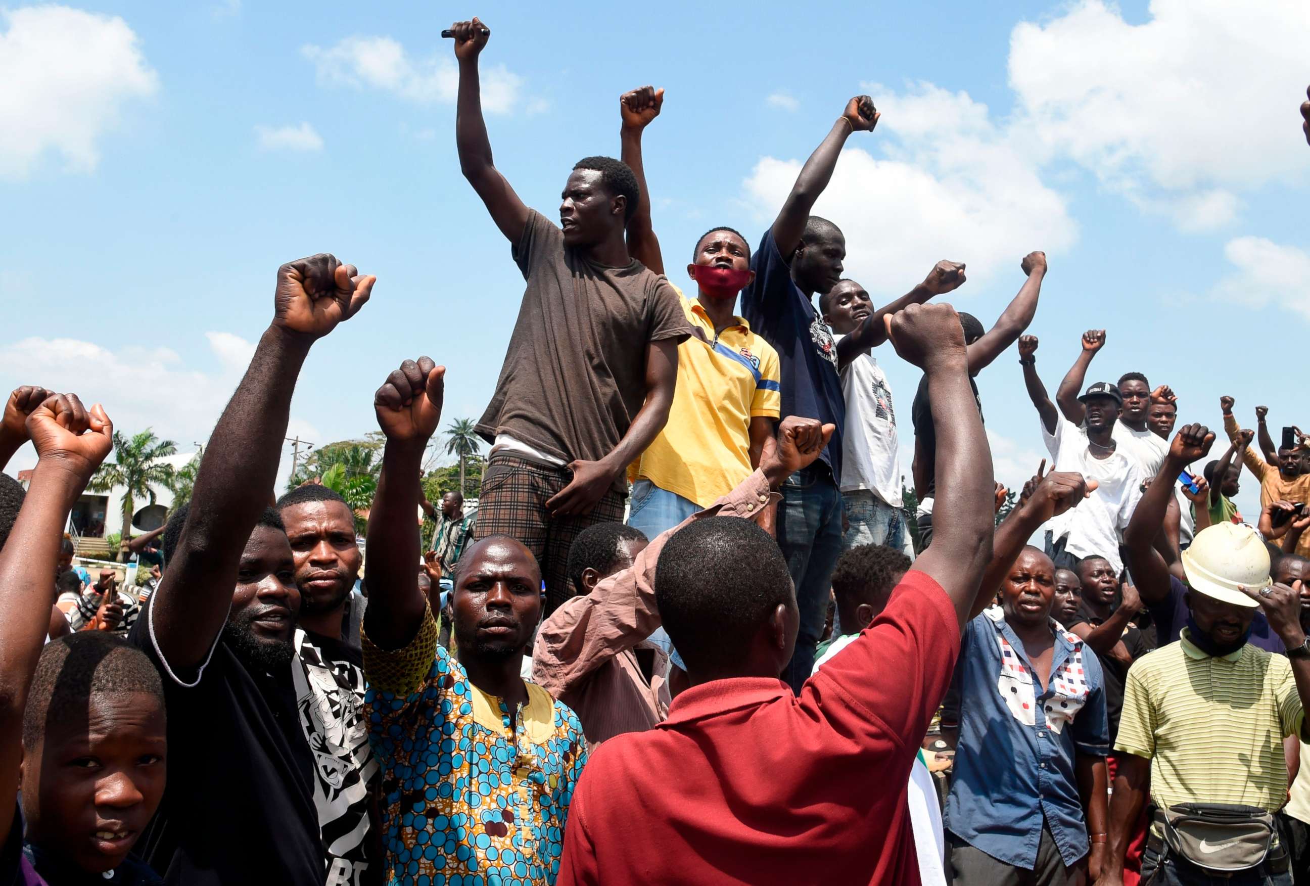 PHOTO: Protesters chant and sing solidarity songs as they barricade barricade the Lagos-Ibadan expressway to protest against police brutality and the killing of protesters by the military, at Magboro, Ogun State, on Oct. 21, 2020.