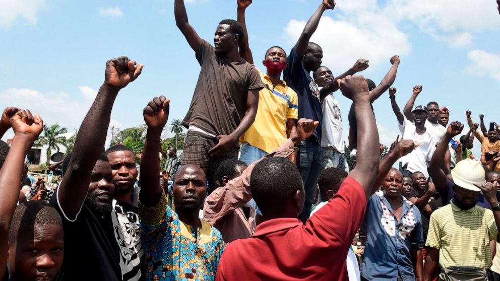 PHOTO: Protesters chant and sing solidarity songs as they barricade barricade the Lagos-Ibadan expressway to protest against police brutality and the killing of protesters by the military, at Magboro, Ogun State, on Oct. 21, 2020.