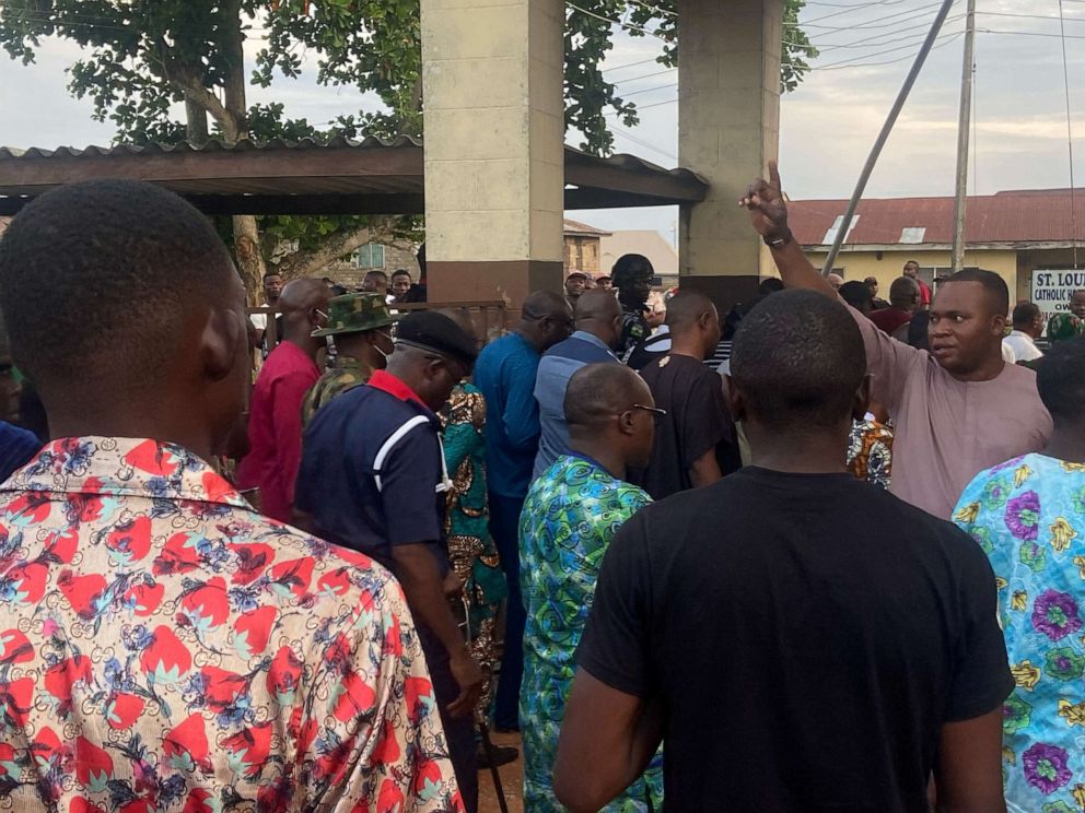 PHOTO: Relatives of churchgoers who were attacked by gunmen during Sunday's church service gather as health workers attend to victims brought in by ambulance after the attack at St. Francis Catholic Church, in Owo, Nigeria June 5, 2022.