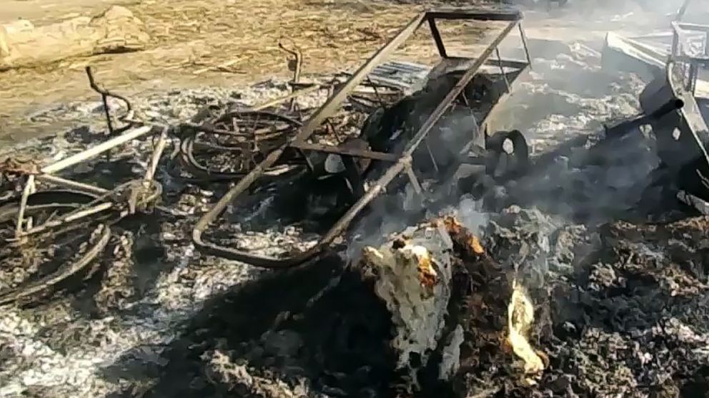 PHOTO: Smoldering ashes and charred items are seen on the ground in Budu near Maiduguri on July 28, 2019, after the latest attack by Boko Haram fighters on a funeral in northeast Nigeria has left 65 people dead.