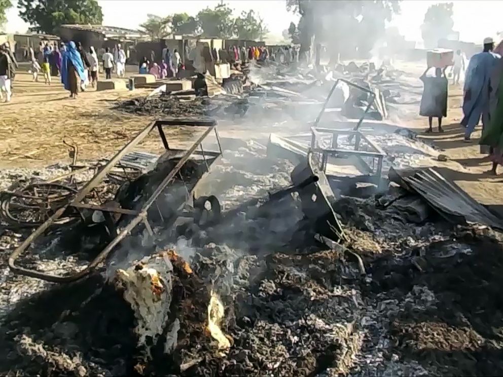 PHOTO: Smoldering ashes and charred items are seen on the ground in Budu near Maiduguri on July 28, 2019, after the latest attack by Boko Haram fighters on a funeral in northeast Nigeria has left 65 people dead.