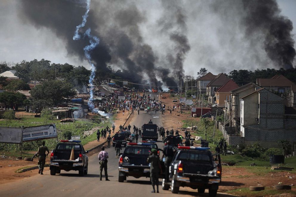 PHOTO: Nigerian police fire teargas at people during clashes in the Apo district of Abuja, Nigeria, on Oct. 20, 2020, amid ongoing protests against police brutality and the now-disbanded Special Anti-Robbery Squad (SARS).