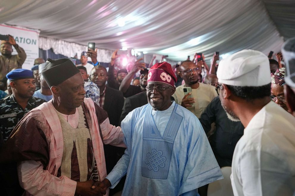 PHOTO: Bola Tinubu of the ruling All Progressives Congress (APC) party, center, celebrates with supporters at his campaign headquarters after being declared the winner of Nigeria's presidential election in Abuja on March 1, 2023.