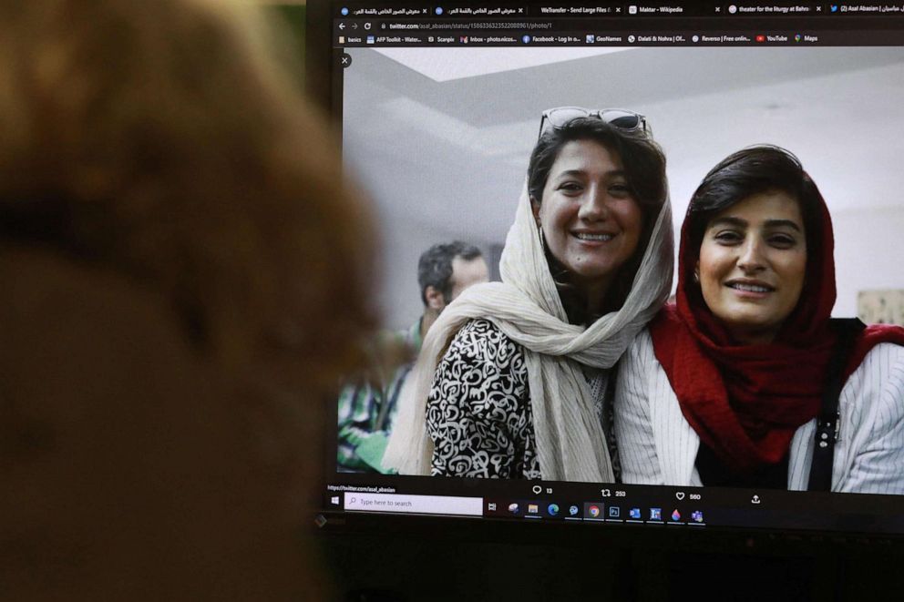 PHOTO: A woman looks at a picture of Iranian reporters Niloofar Hamedi and Elahe Mohammadi posted on twitter, in Nicosia, Cyrpus, on Nov. 2, 2022.