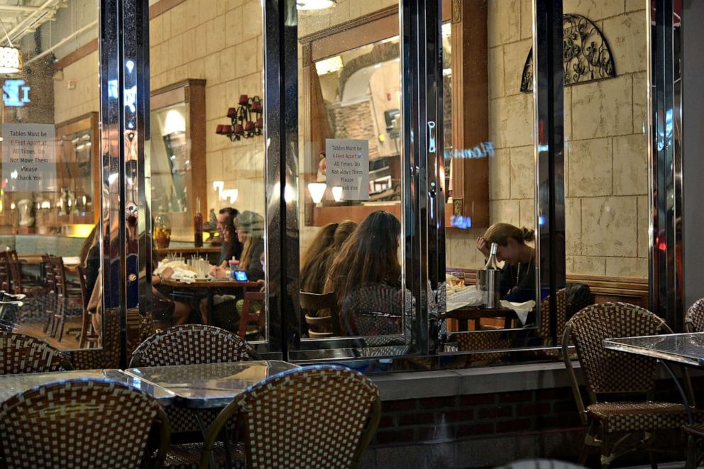 PHOTO: Diners are seen eating indoors at the Greek Taverna on Nov. 09, 2020, in Edgewater, N.J.