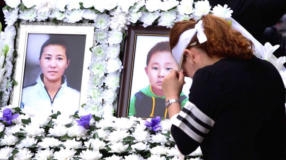 PHOTO: People attend a funeral service in Seoul, South Korea, Sept. 21, 2019, for a 42-year-old defector mother and her 6-year-old son, who were found dead of starvation.