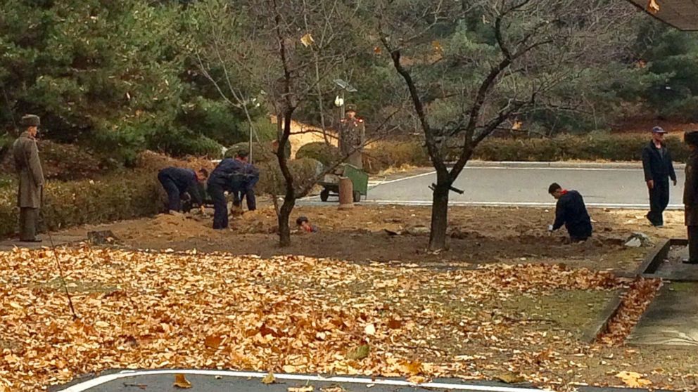PHOTO: North Korean soldiers dig a trench and plant trees in the area where, on Nov. 13, a defector ran across the border at the Demilitarized Zone dividing North Korea and South Korea, Nov. 22, 2017. 
