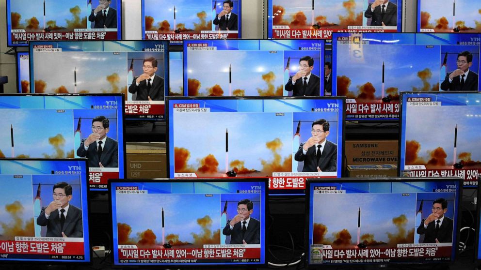 PHOTO: Television screens show a news report about the latest North Korean missile launch with file footage of a North Korean missile test, at an electronic market in Seoul on Nov. 3, 2022.