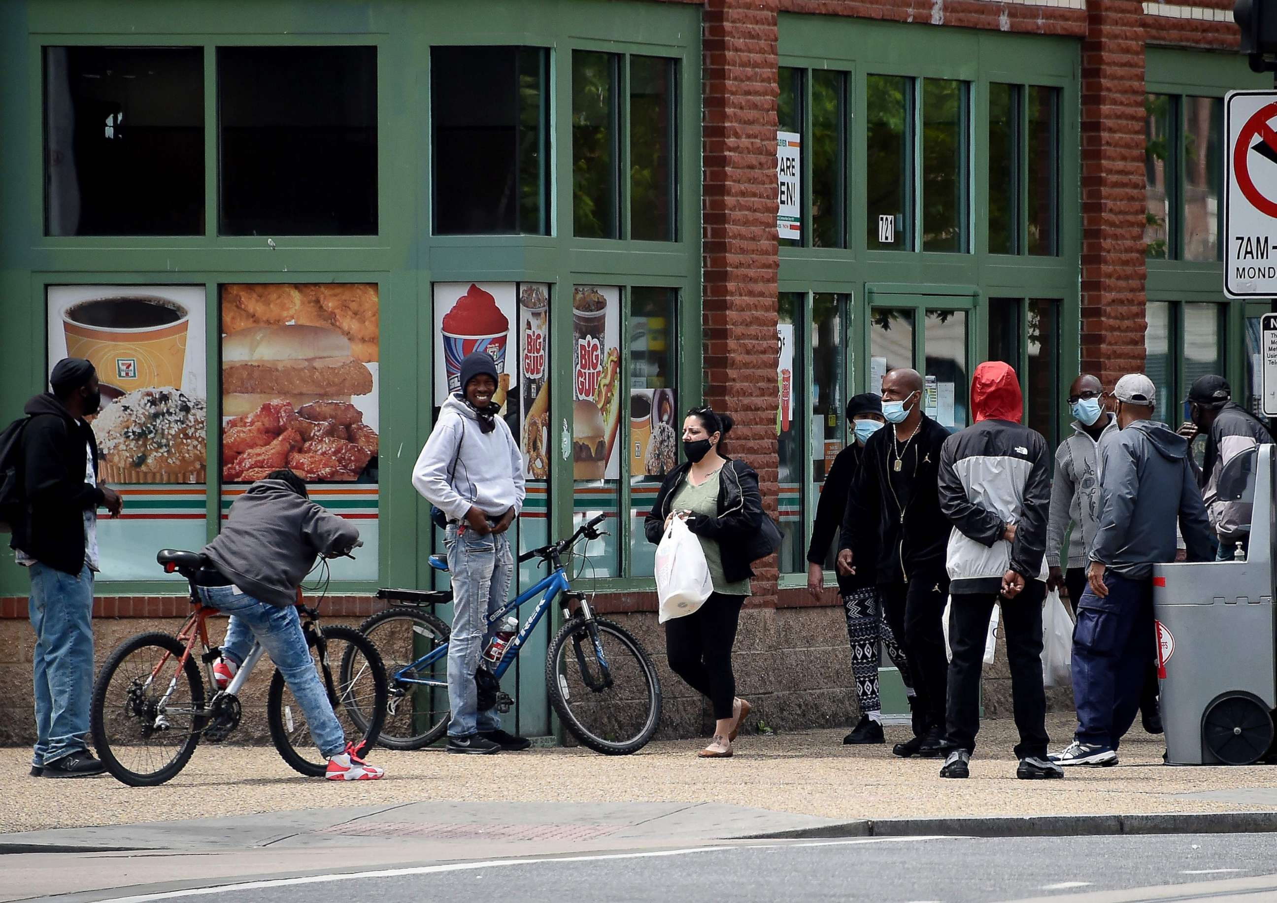 PHOTO: People in the Southeast neighborhoods of Washington stand in the street without respecting social distances, amid the coronavirus pandemic, May 19, 2020.
