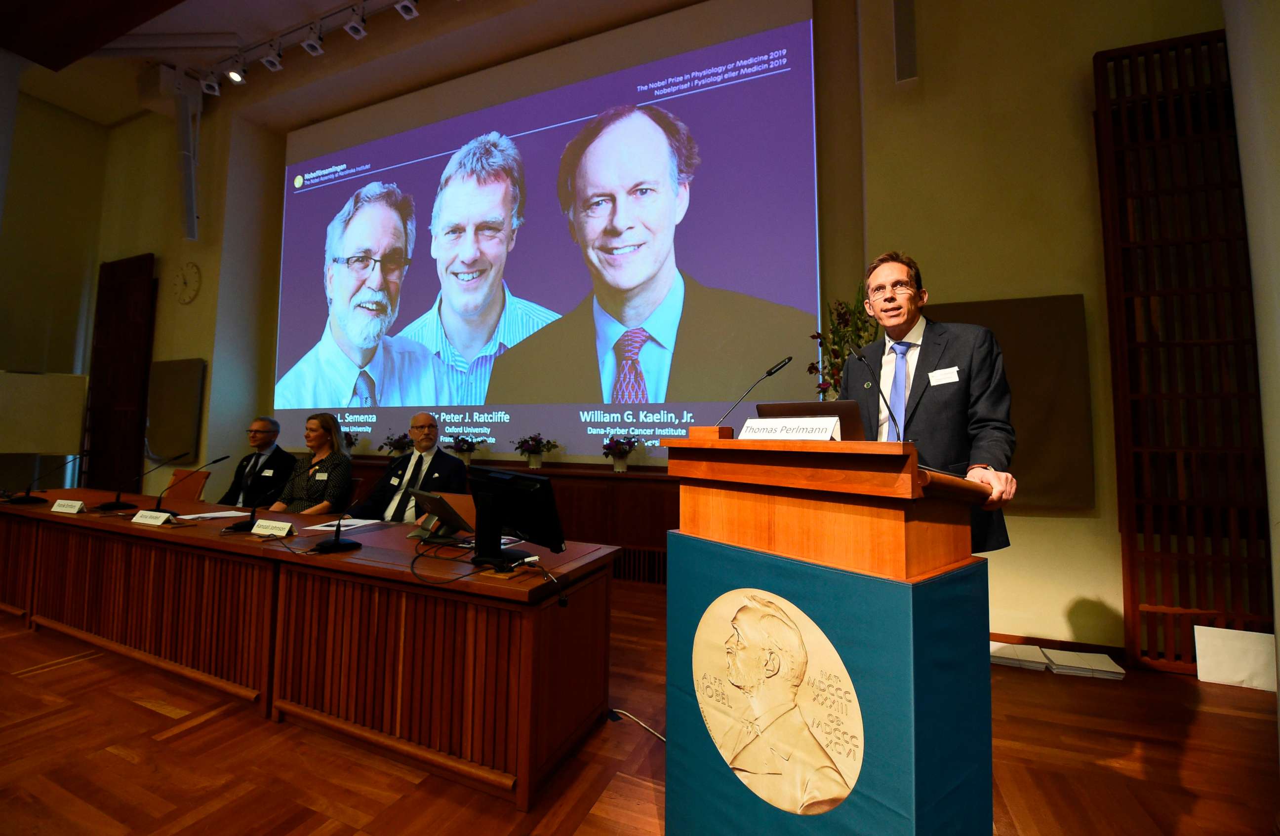 PHOTO: Thomas Perlmann (right), the secretary of the Nobel Committee, speaks as the winners are announced of the 2019 Nobel Prize in Physiology or Medicine during a press conference at the Karolinska Institute in Stockholm, Sweden, Oct. 7, 2019.