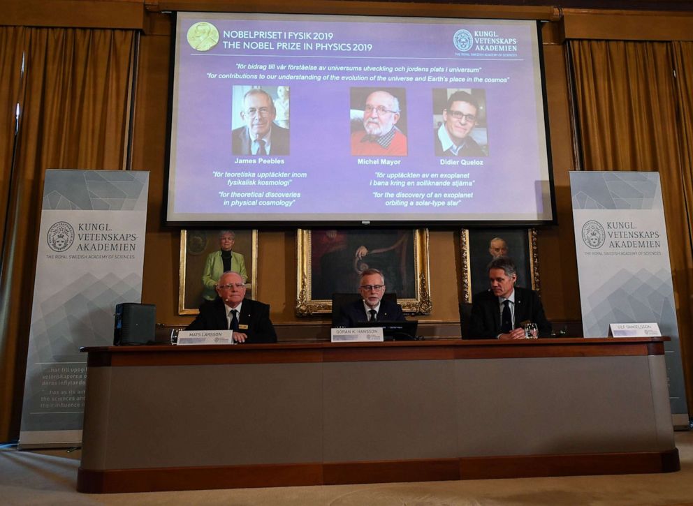 PHOTO: Members of the Nobel Committee for Physics sit in front of a screen displaying the names of the winners of the 2019 Nobel Prize in Physics at the Royal Swedish Academy of Sciences in Stockholm on Oct. 8, 2019.