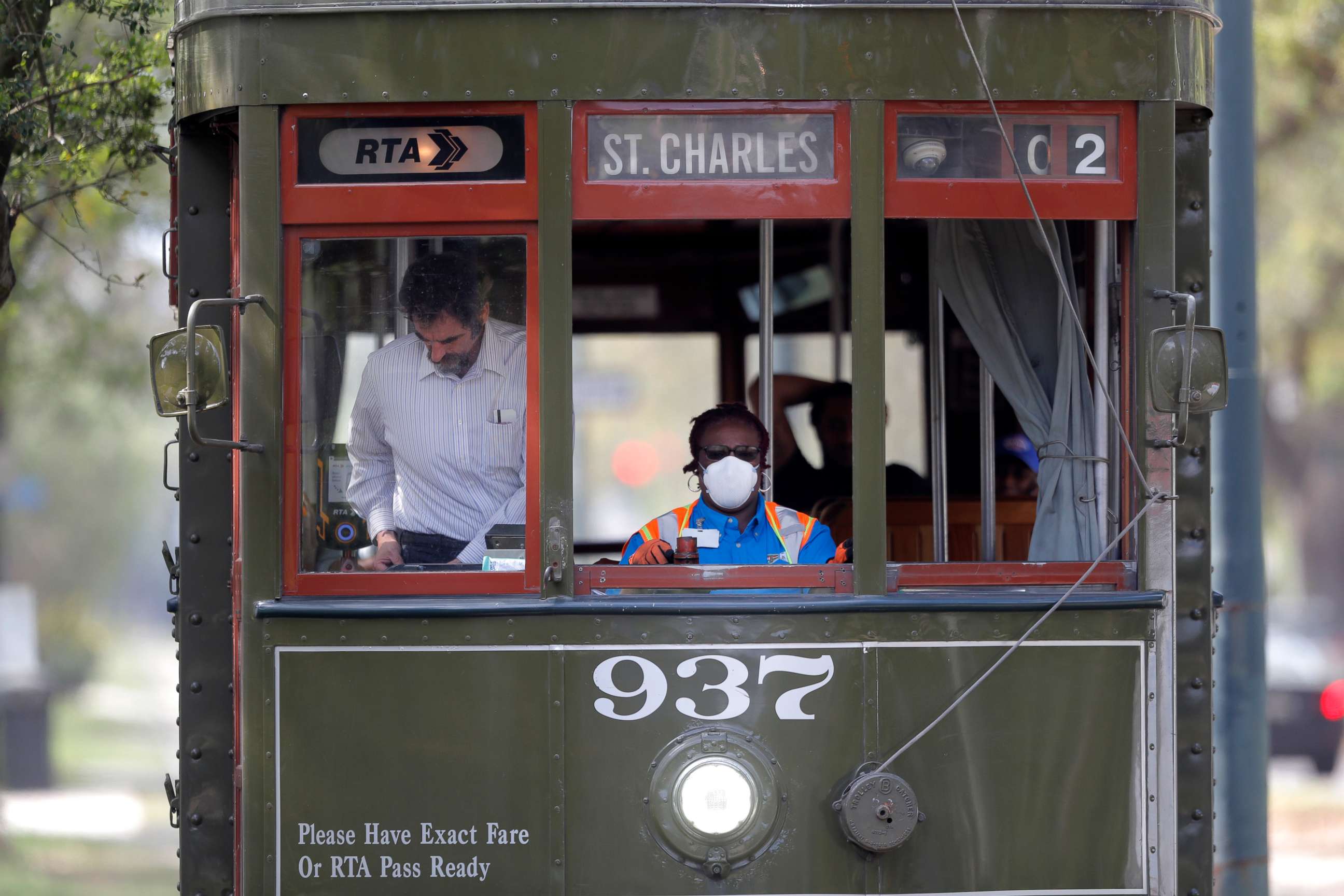 PHOTO: A streetcar conductor wears a mask due to the coronavirus pandemic as she runs her route on St. Charles Ave. in New Orleans, March 19, 2020.