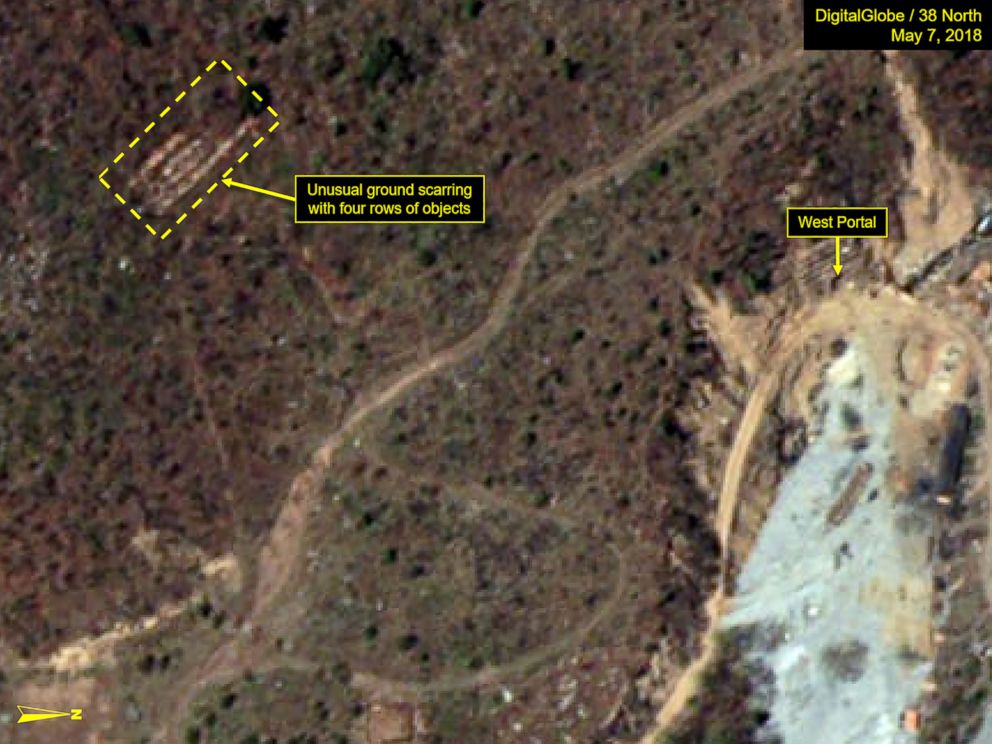 PHOTO: A satellite image from May 7, 2018, appears to show ground scarring with four rows of objects at North Korea’s Punggye-ri nuclear test site.