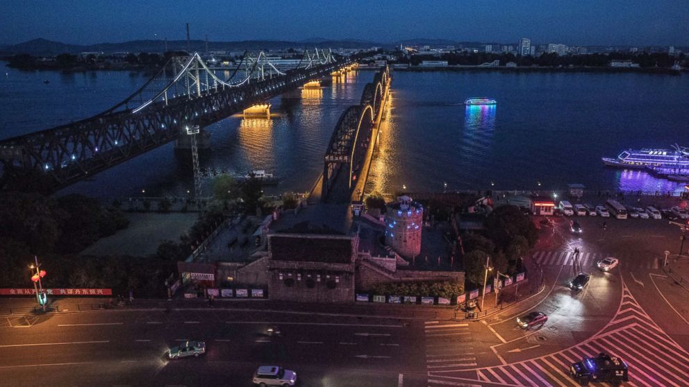 PHOTO: The "Friendship Bridge", left, and "Broken Bridge" on the Yalu river from the border city of Dandong in northern China across from the city of Sinuiju, North Korea on May 23, 2017. 