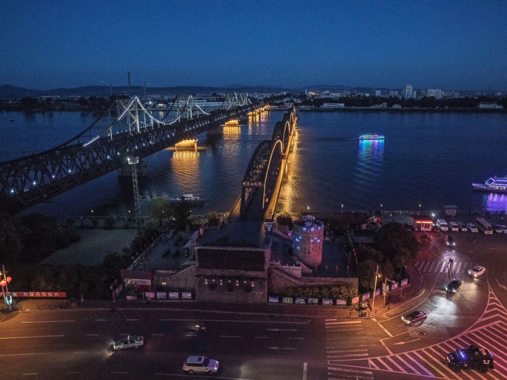 PHOTO: The Friendship Bridge, left, and Broken Bridge on the Yalu river from the border city of Dandong in northern China across from the city of Sinuiju, North Korea on May 23, 2017.