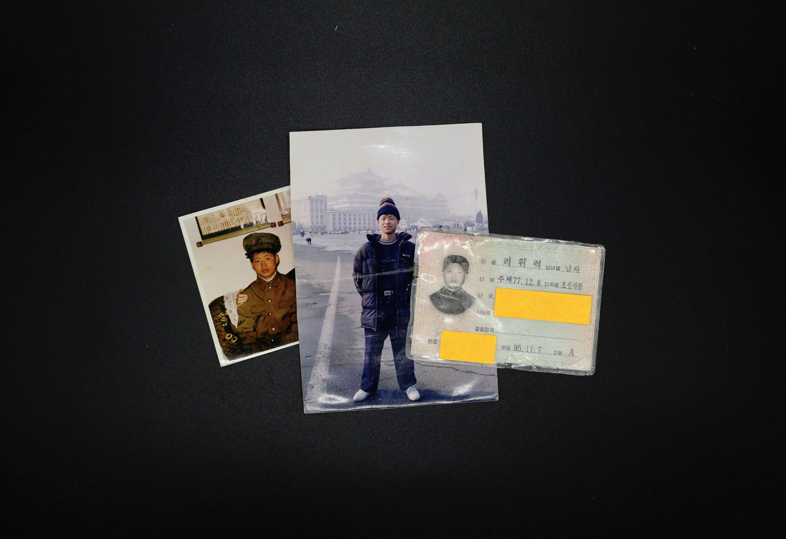 PHOTO: Photographs and North Korean identification card owned by Lee Oui-ryuk are seen in Seoul, South Korea, Sept. 12, 2017.