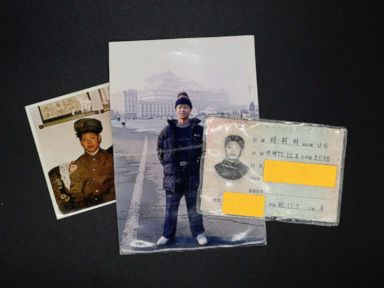 PHOTO: Photographs and North Korean identification card owned by Lee Oui-ryuk are seen in Seoul, South Korea, Sept. 12, 2017.