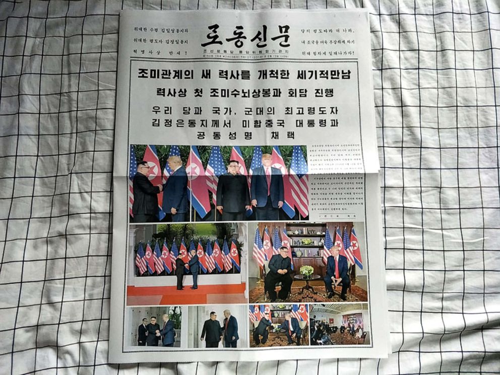 PHOTO: The first summit between U.S. President Donald Trump and North Korean leader Kim Jong Un is featured on the front page of North Korea's state-run newspaper Rodong Sinmun in Pyongyang on June 12, 2018