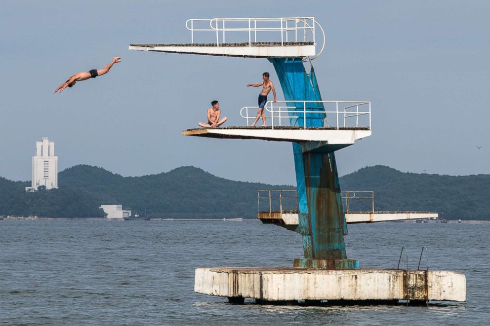 PHOTO: A man dives into the sea from a platform on Aug. 22, 2018 in Wonsan, North Korea.