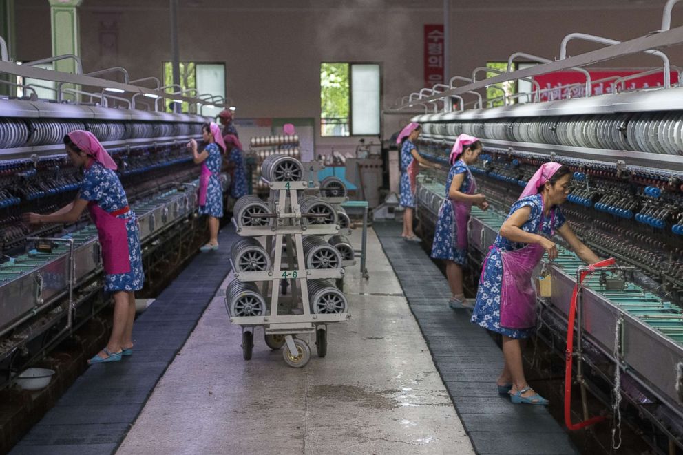 PHOTO: Women work in the Kim Jong Suk Silk Factory on Aug. 21, 2018 in Pyongyang, North Korea. 