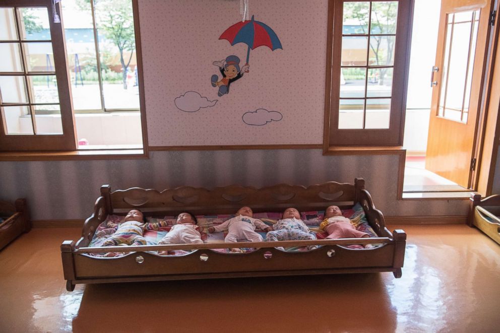 PHOTO: Employee's babies sleep in the nursery at the Kim Jong Suk Silk Factory on Aug. 21, 2018 in Pyongyang, North Korea. 