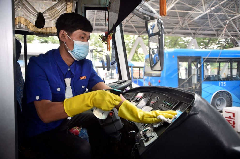 PHOTO: A driver of the Ryonmot Trolley Bus Office disinfects a trolley bus as part of preventative measures against COVID-19 in Pyongyang, on June 9, 2022.