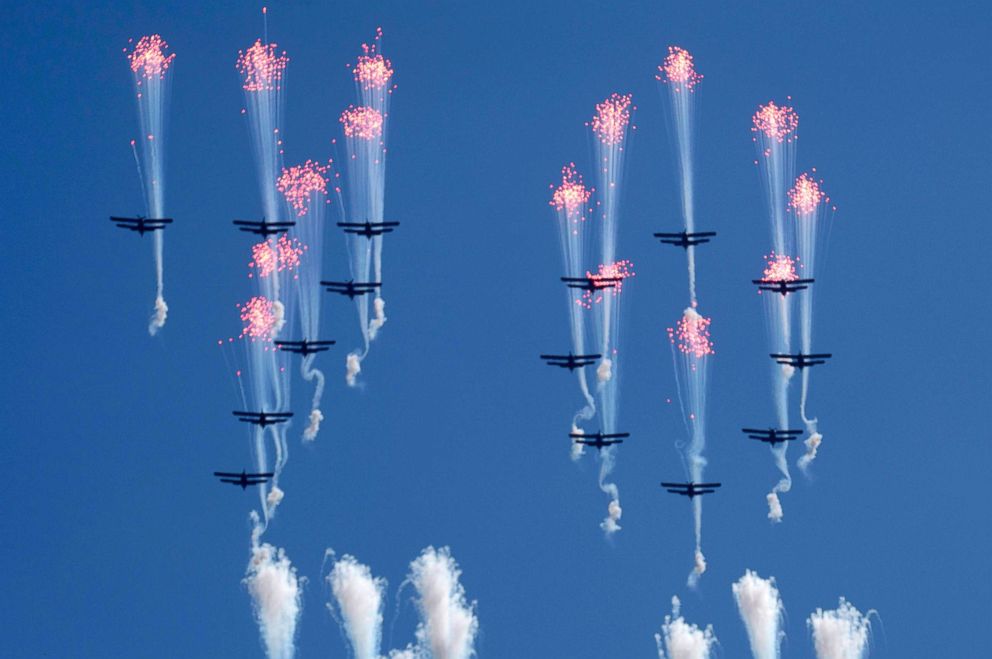 PHOTO: Airplanes forming the number 70 fly in formation and fire flares during a parade for the 70th anniversary of North Korea's founding day in Pyongyang, North Korea, Sept. 9, 2018.