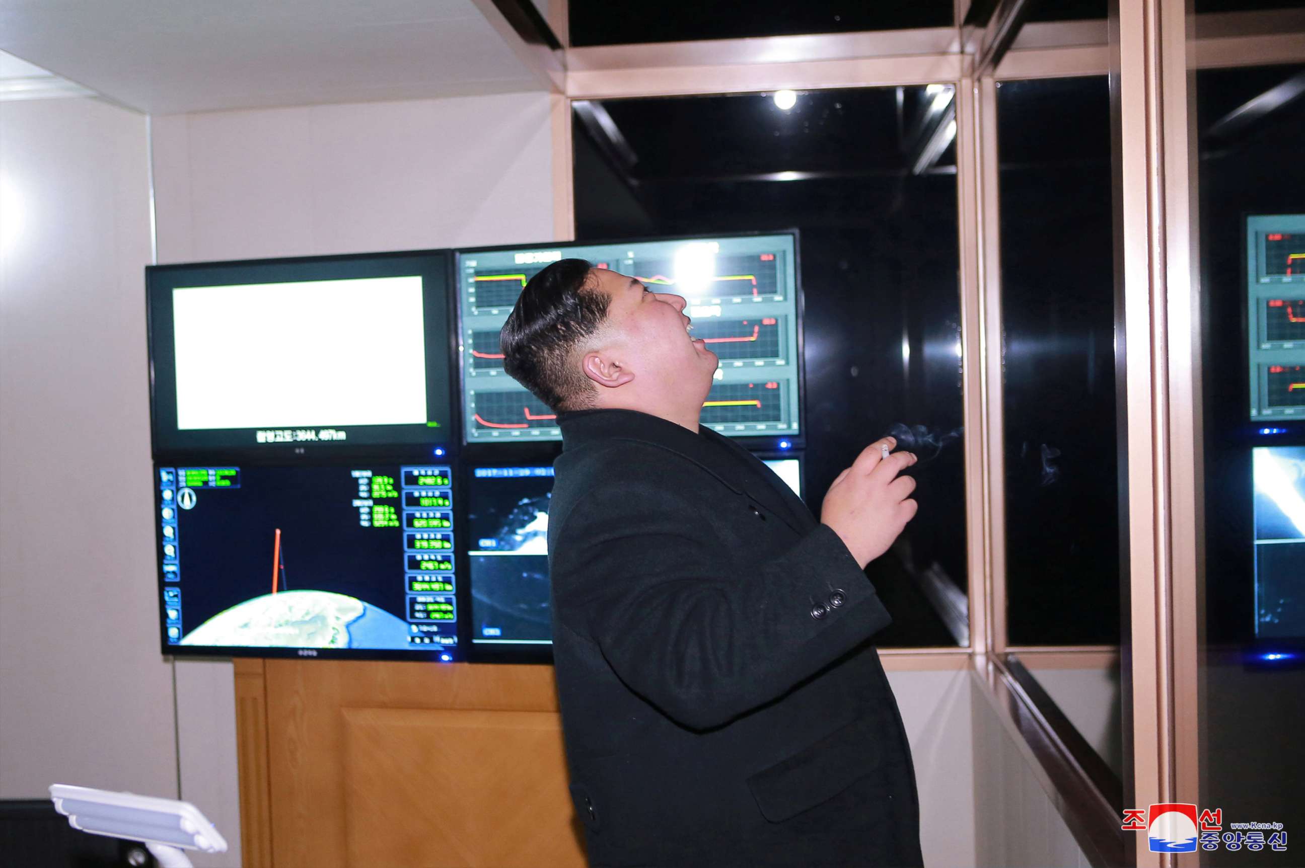 PHOTO: North Korea's leader Kim Jong Un is seen peering through a window in a photo released by North Korea's Korean Central News Agency on Nov. 30, 2017 after the successful test launch of a Hwasong-15 intercontinental ballistic rocket.