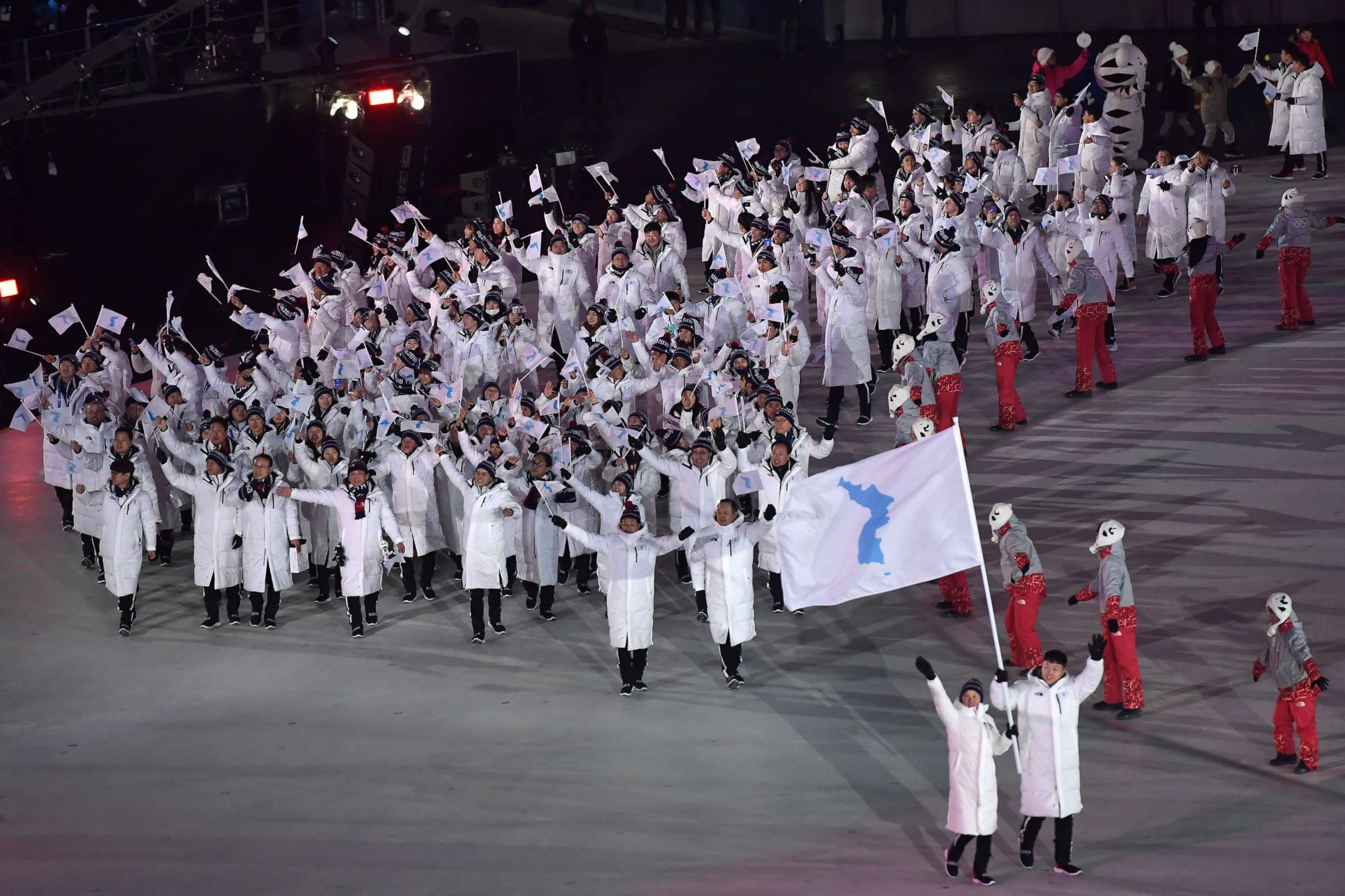 PHOTO: Unified Korea's flag-bearers, North Korean Hwang Chung Gum and South Korean Won Yun-jong, lead the Unified Korea's delegation as they parade during the opening ceremony of the Pyeongchang 2018 Winter Olympic Games on Feb. 9, 2018.