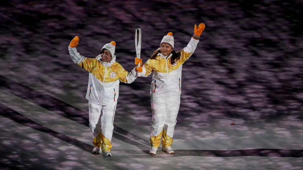 PHOTO: Unified Korea's torchbearers, North Korea's Jong Su Hyon and South Korea's Park Jong-ah, hold the Olympic torch during the opening ceremony of the Pyeongchang 2018 Winter Olympic Games, Feb. 9, 2018. 