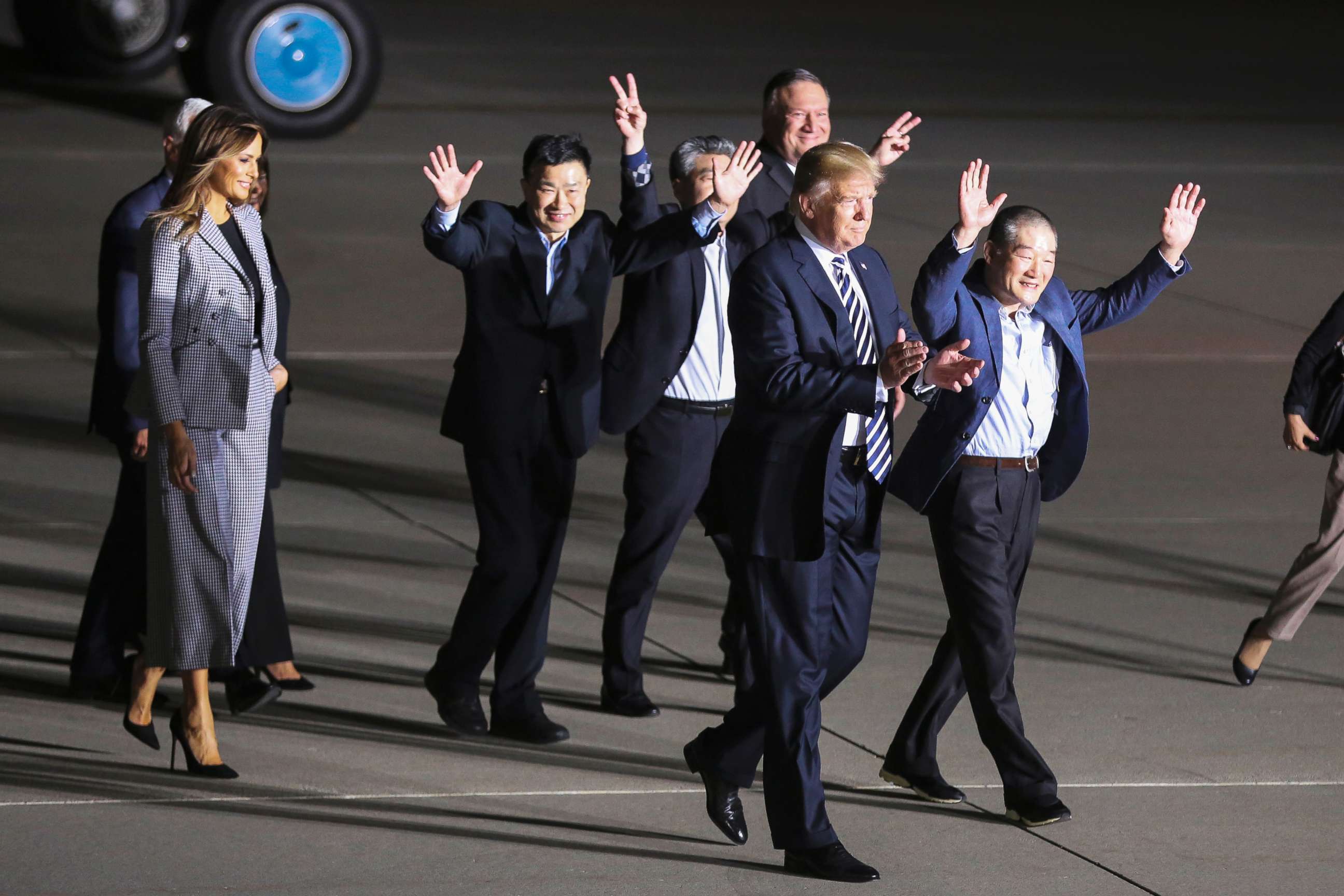 PHOTO: President Donald Trump, first lady Melania Trump Vice President Mike Pence and Secretary of State Mike Pompeo walk with the Americans formerly held hostage in North Korea, at Joint Base Andrews, Maryland on May 10, 2018.