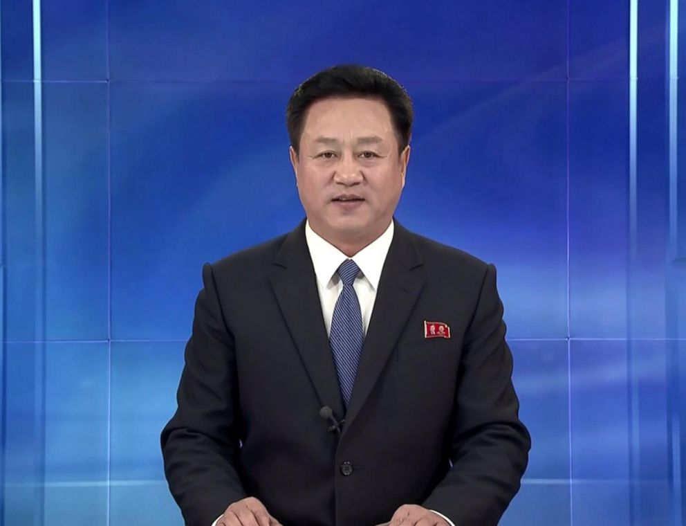 PHOTO: An anchorperson on Korean Central Television wears a Western suit and speaks in a confident tone.