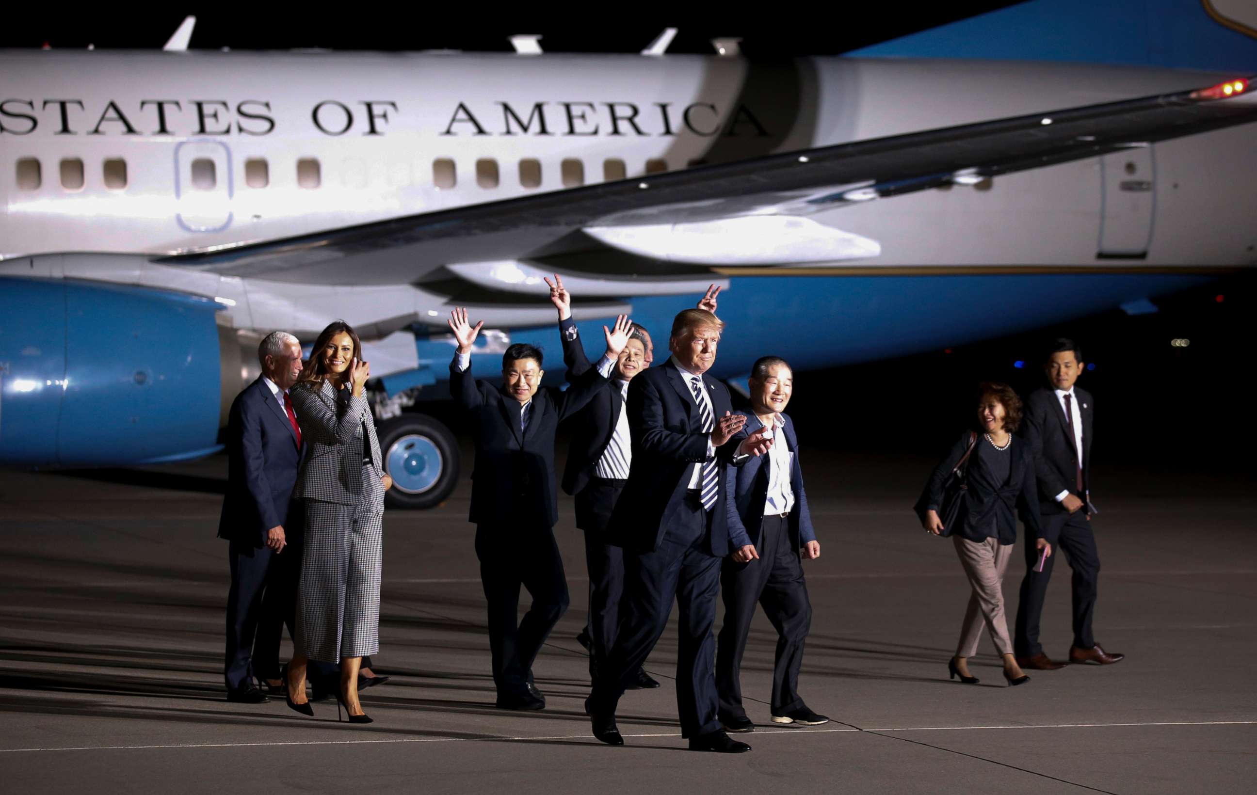 PHOTO: President Donald Trump and first lady Melania Trump walk with former North Korean detainees and others, upon their arrival,May 10, 2018, at Andrews Air Force Base, Md.