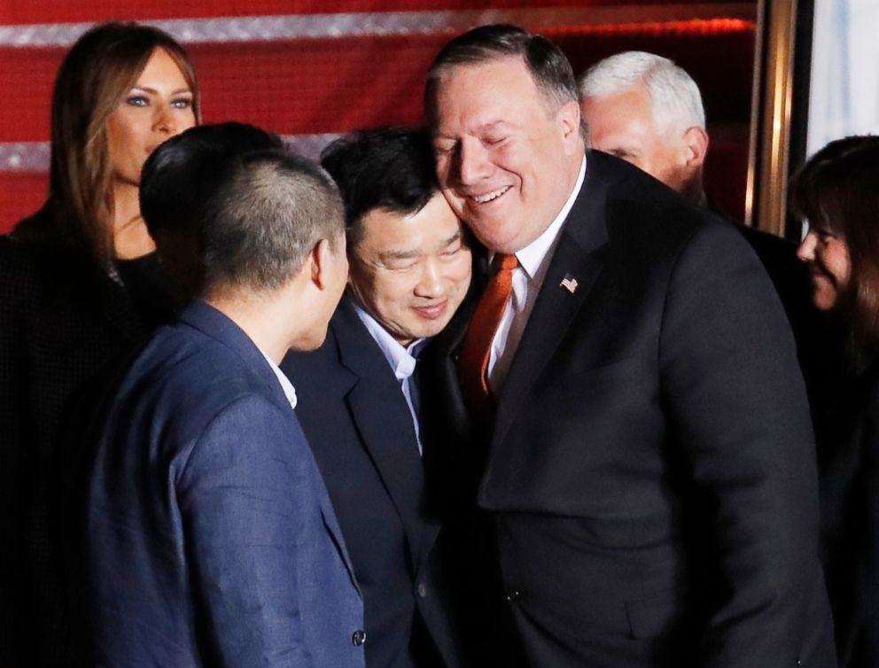 PHOTO: Secretary of State Mike Pompeo, right, embraces former North Korean detainee upon their arrival, May 10, 2018, at Andrews Air Force Base, Md.