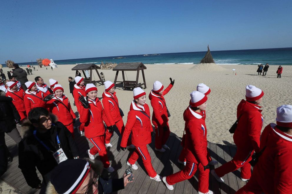 PHOTO: A group of North Korean cheerleaders for the Pyeongchang Winter Olympics wave as they visit Gyeongpo Beach in Gangneung, South Korea, Feb. 13, 2018. 
