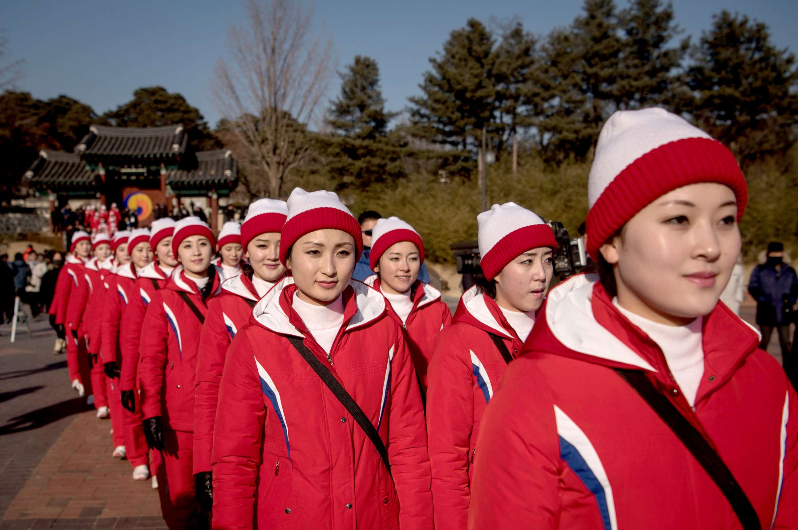 PHOTO: North Korean cheerleaders walk through Ojukheon House, one of the oldest traditional Korean houses in South Korea, in Gangneung, Feb. 13, 2018.