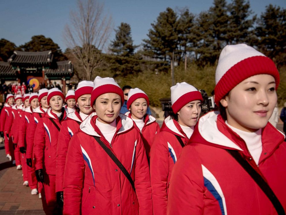PHOTO: North Korean cheerleaders walk through Ojukheon House, one of the oldest traditional Korean houses in South Korea, in Gangneung, Feb. 13, 2018.