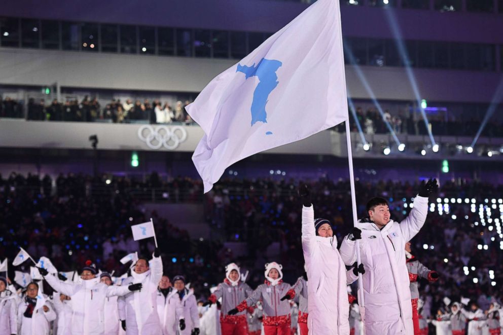 PHOTO: North Korea's ice hockey player Hwang Chung Gum (L) and South Korea's bobsledder Won Yun-jong (R) lead the Unified Korea's delegation at the opening ceremony of the Pyeongchang 2018 Winter Olympic Games at the Pyeongchang Stadium, Feb. 9, 2018.  