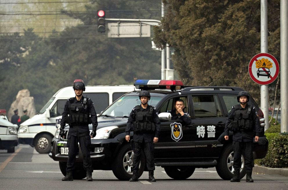 PHOTO: Police in tactical gear block a road leading to the Diaoyutai State Guesthouse in Beijing, March 27, 2018. 