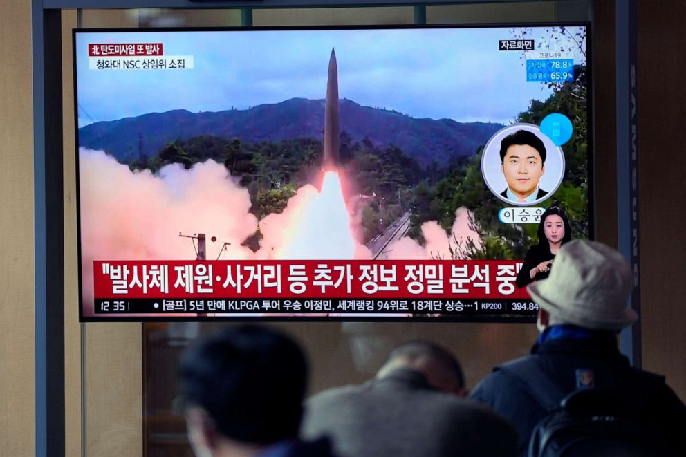 PHOTO: People watch a TV screen showing a news program reporting about North Korea's missile launch with file footage at a train station in Seoul, South Korea, Oct. 19, 2021. 