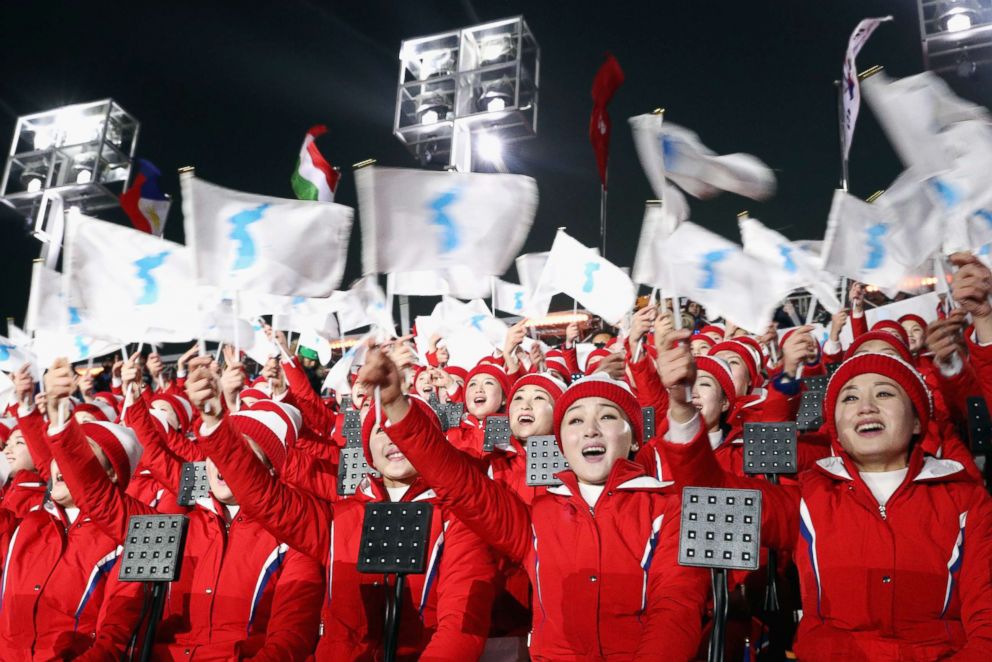 PHOTO: Members of the North Korean cheerleader squad sing and wave flags prior to the Opening Ceremony of the 2018 Winter Olympic Games in Pyeongchang, South Korea, Feb. 9, 2018.