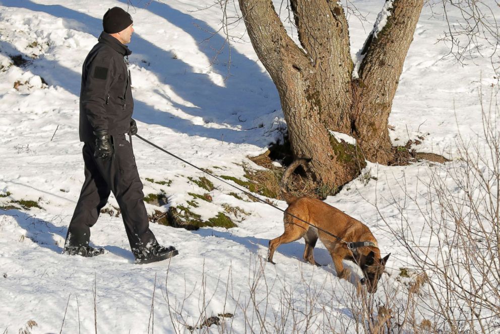 PHOTO: A police officer with a dog examines the area outside the home of real estate investor Tom Hagen and his wife Anne-Elisabeth Falkevik Hagen, who according to the authorities is suspected to have been kidnapped, in Fjellhamar, Norway, Jan. 10, 2019.