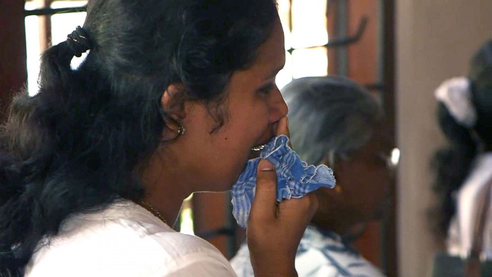 PHOTO: A woman cries at the wake of a woman, her two daughters, and her son, in Negombo, Sri Lanka, on April 23, 2019. All died in the Easter bombing attacks in Sri Lanka.