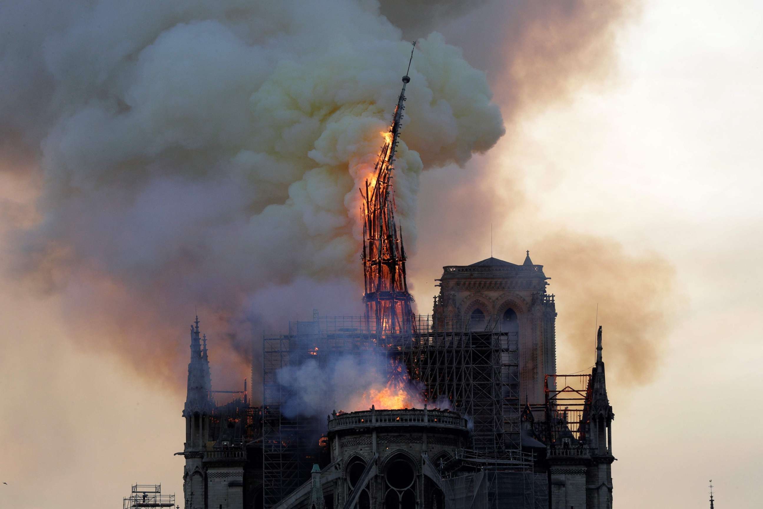 PHOTO: The steeple of the landmark Notre-Dame Cathedral collapses as the cathedral is engulfed in flames in Paris, April 15, 2019. 