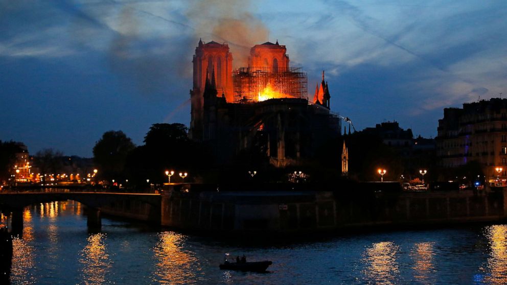 PHOTO: Firefighters tackle the blaze as flames rise from Notre Dame cathedral as it burns in Paris, April 15, 2019.