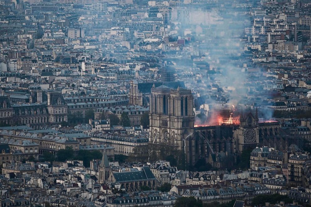 Smoke and flames rise during a fire at Notre-Dame Cathedral in Paris, April 15, 2019.