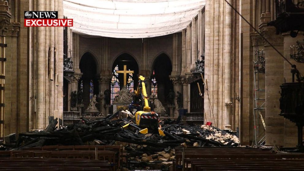 PHOTO: Debris litters the nave of Paris' Notre Dame cathedral nearly a month after the devastating fire damaged a large section of roof in April 2019.