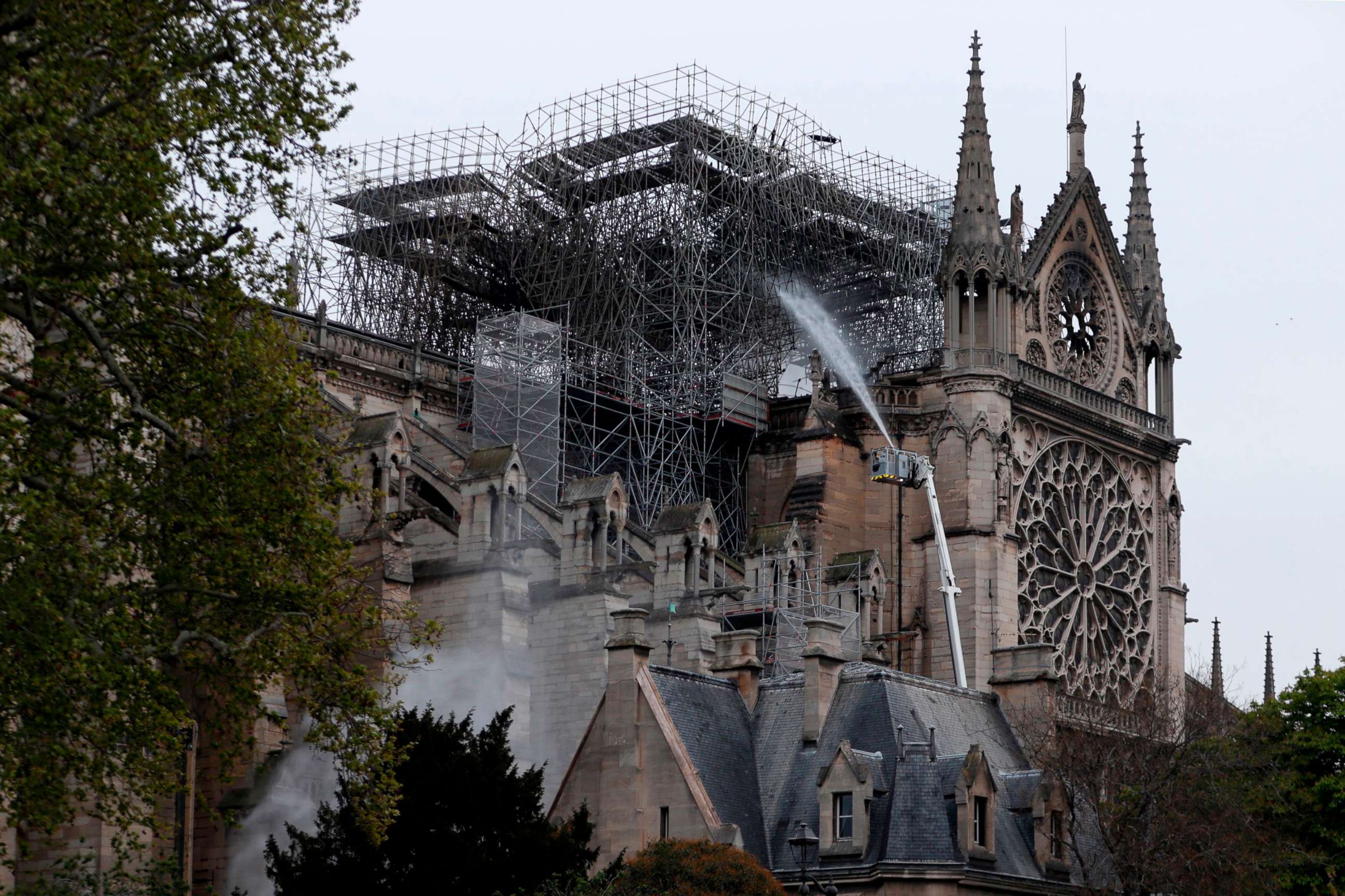 PHOTO:Firefighters spray water as they work to extinguish a fire at Notre-Dame Cathedral in Paris early on April 16, 2019.