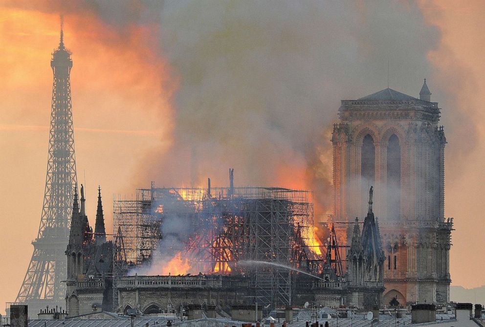 PHOTO: Flames and smoke rise from the blaze after the spire toppled over on Notre Dame cathedral in Paris, April 15, 2019.